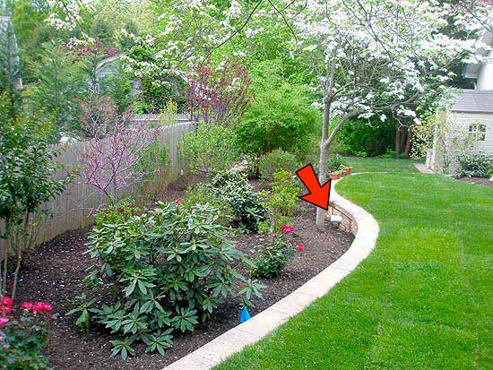 Completed Drainage System with Landscaping Ends Here (Red Arrow) Allowing for Runoff Within Property Lines